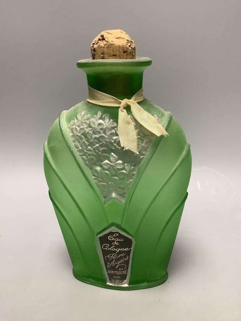 A papier mache and velvet ‘sedan chair’ scent bottle case, associated bottle and a Flore d’Argent eau de cologne bottle